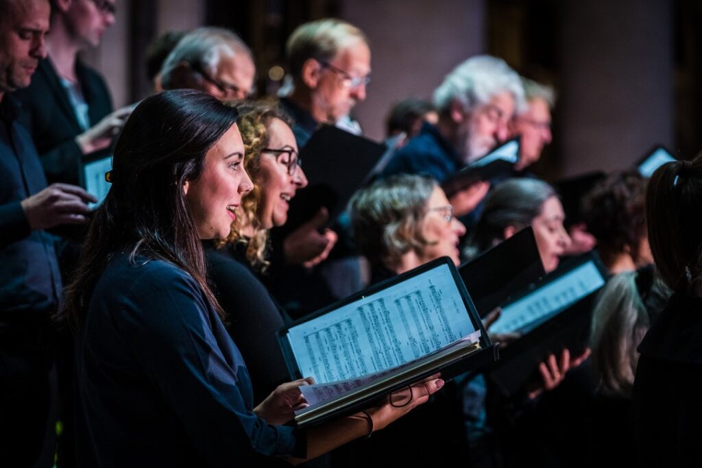 Choir singing with sheet music