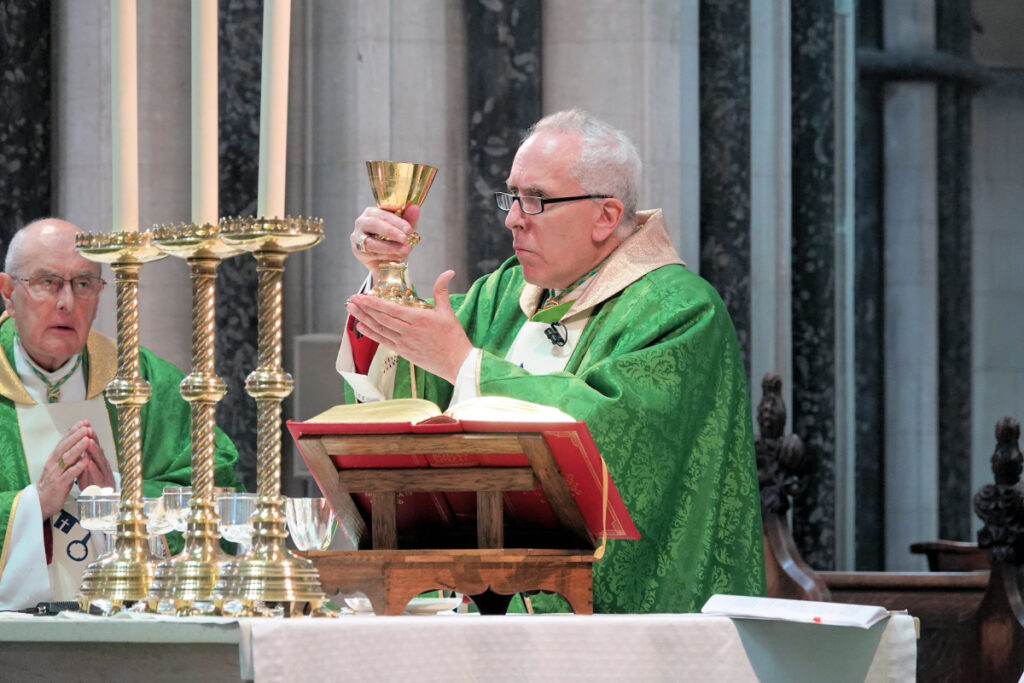 Bishop holding goblet