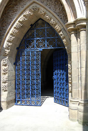 Ornate blue iron door.