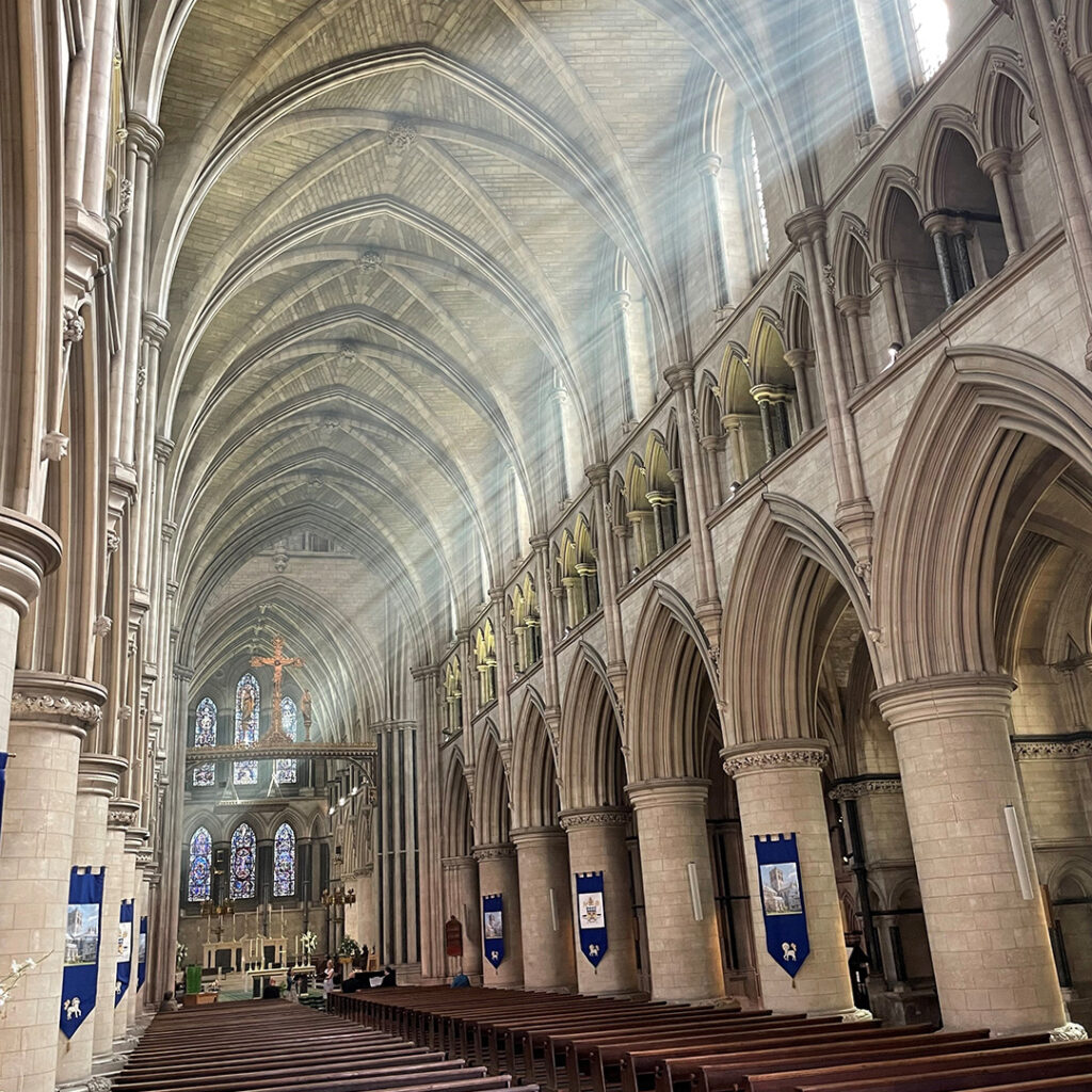 Sun flooding in through high windows inside St John the Baptist Cathedral.