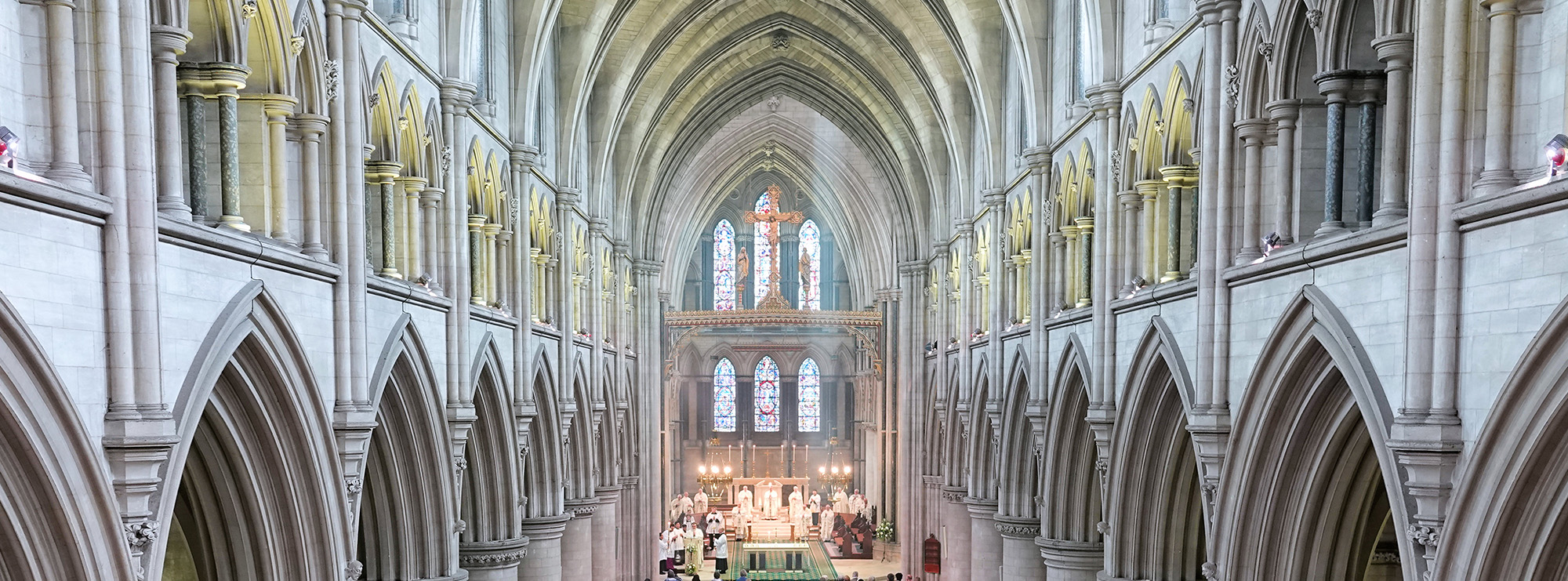 Interior of St John the Baptist Cathedral with stone arches.