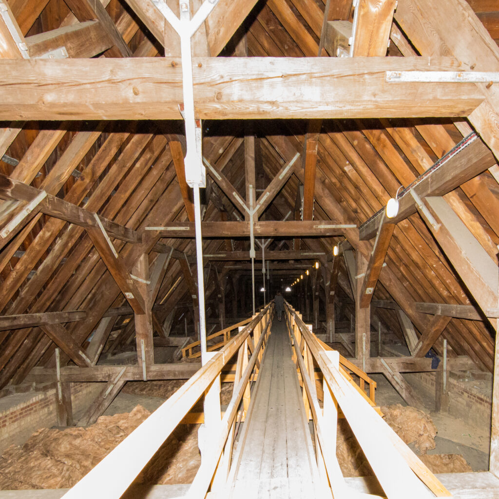 St John the Baptist Cathedral roof interior, wooden beams and wooden walkway.