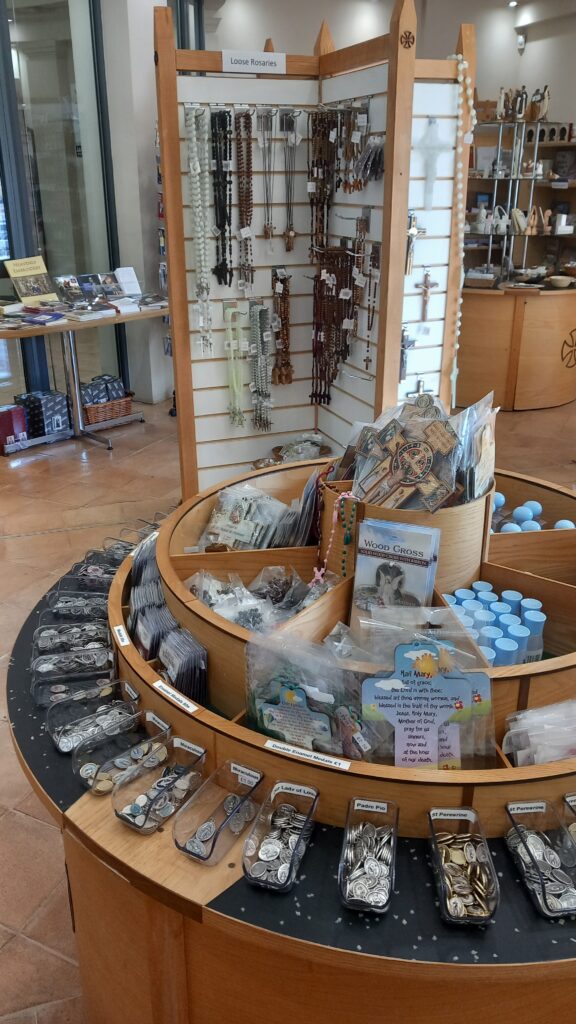 Circular shelf containing religious items.